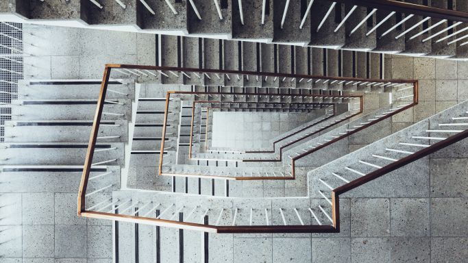 The picture shows an empty staircase of a multi-storey building (Source: Norman Posselt/Getty Images) The picture shows an empty staircase of a multi-storey building